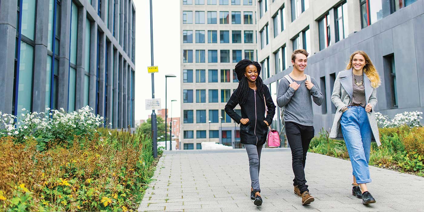 Students walking together at Central Village