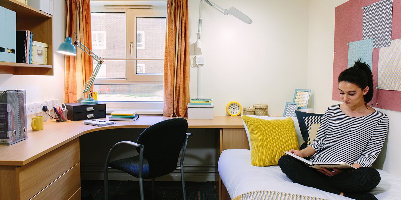 Student sitting in her room