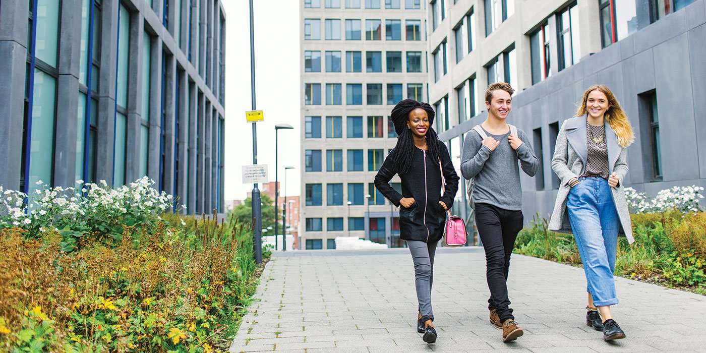Students walking outside central village university of leeds accommodation