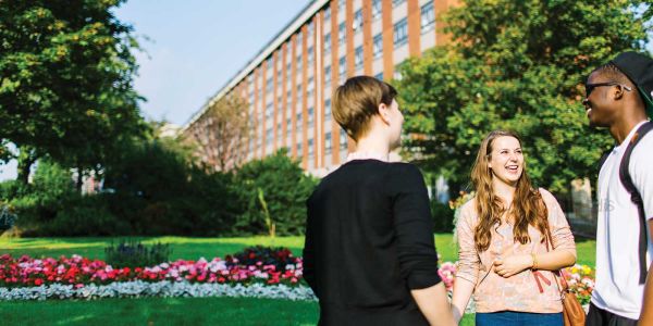 Students talking outside of Henry Price